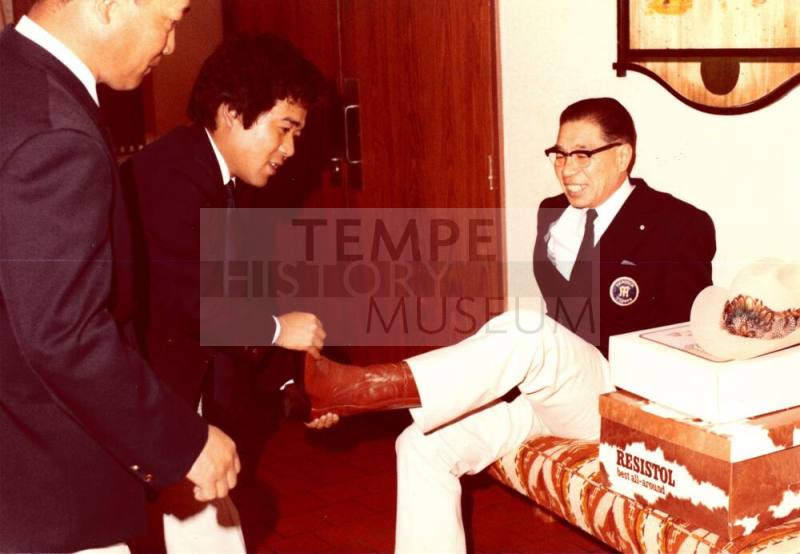 Shojiro Ozu tries on Cowboy Boots at Monti's