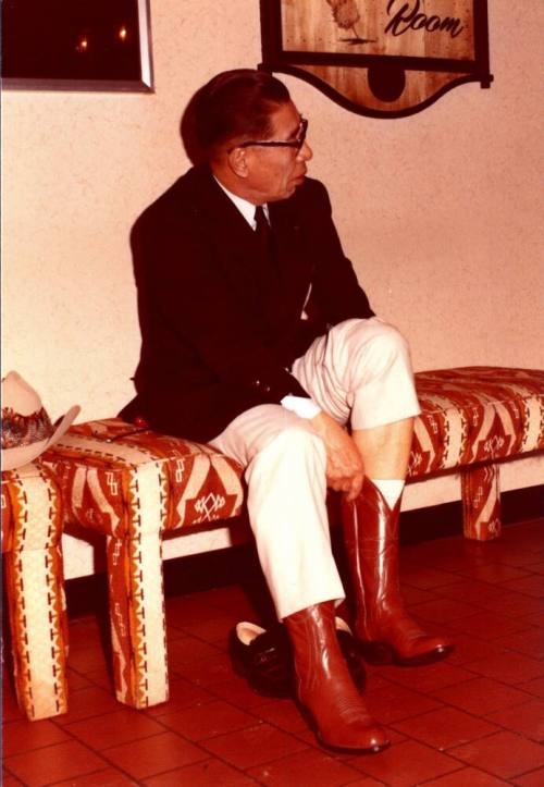 Shojiro Ozu begins to try on Second Cowboy Boot at Monti's