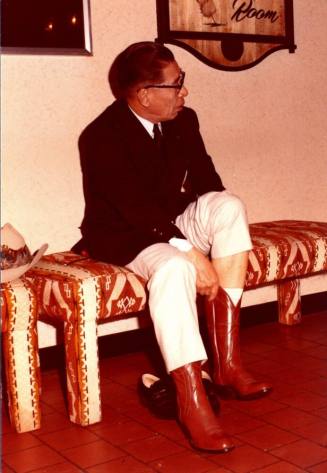 Shojiro Ozu begins to try on Second Cowboy Boot at Monti's