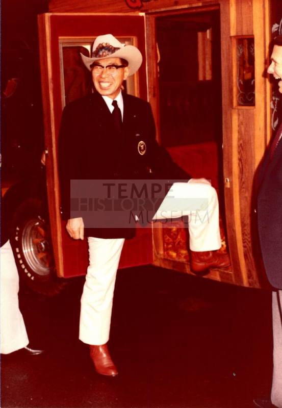 Shojiro Ozu poses next to Stagecoach at Monti's