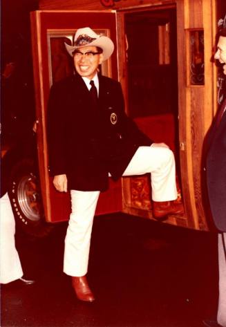 Shojiro Ozu poses next to Stagecoach at Monti's