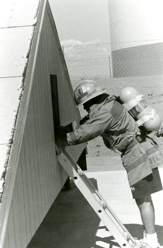 Tempe Fire Department Fireman using Ladder