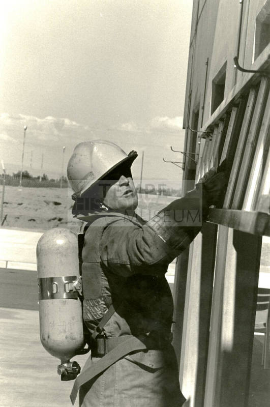 Tempe Fire Department Fireman Holding onto Horizontal Ladder