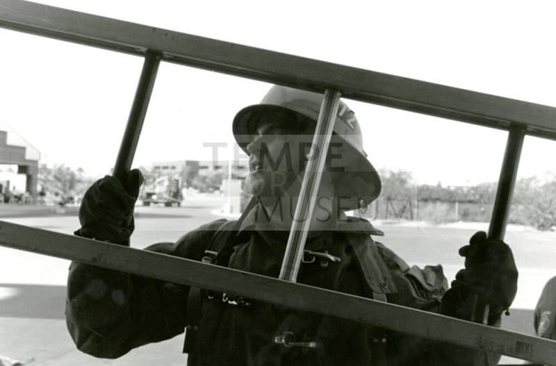 Tempe Fire Department Fireman Carrying Ladder