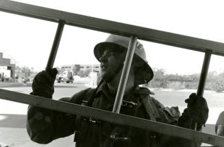 Tempe Fire Department Fireman Carrying Ladder