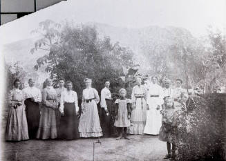 Group photograph of 11 women and 2 girls