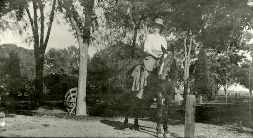 Woman riding horse on Peteresen property