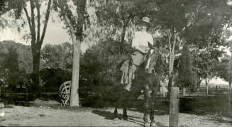 Woman riding horse on Peteresen property