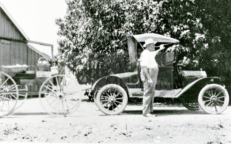 Man standing near car on Petersen Property