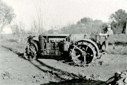 Man riding tractor on Petersen property