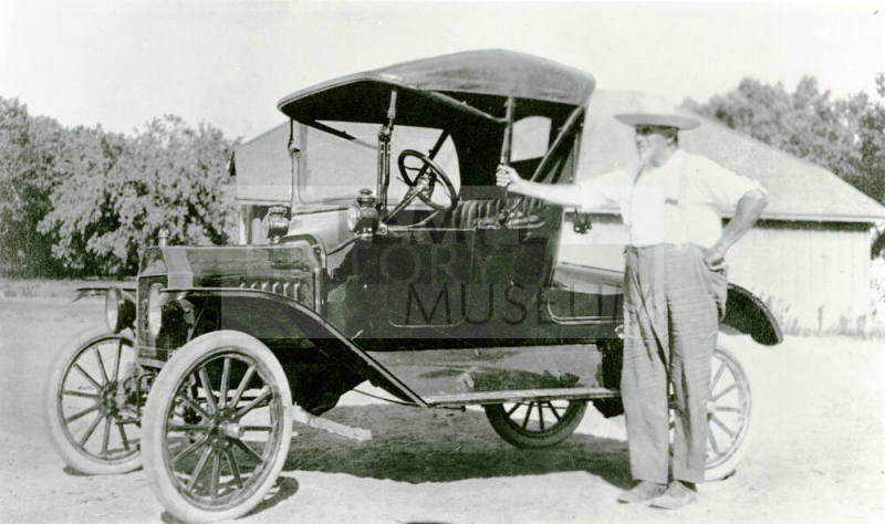 Man with car on Petersen property