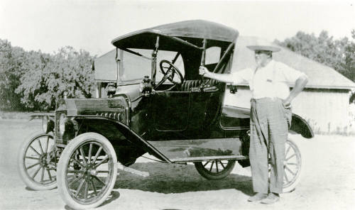 Man with car on Petersen property