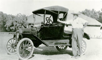 Man with car on Petersen property