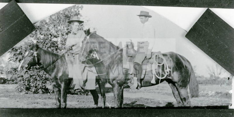 A little boy and girl riding horses on Petersen property