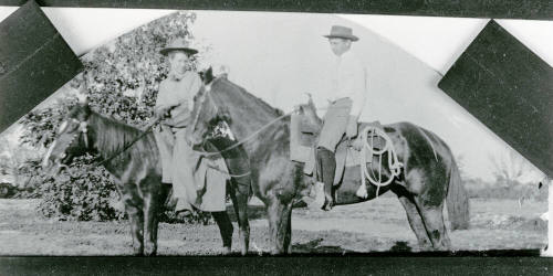 A little boy and girl riding horses on Petersen property
