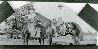 A little boy and girl riding horses on Petersen property