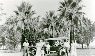 Family of five in front of car on Petersen property