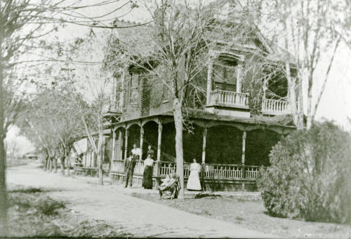 Six people standing in front of the Petersen house
