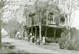 Six people standing in front of the Petersen house