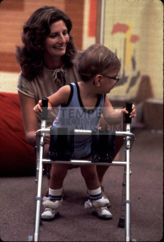 Dr. Roberts with Handicapped Child