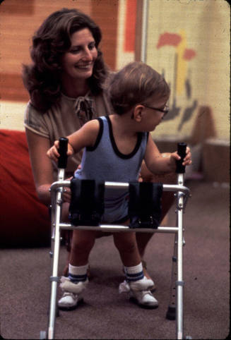 Dr. Roberts with Handicapped Child