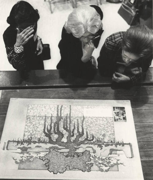 Tempe Art League Members Inspect Woodcut