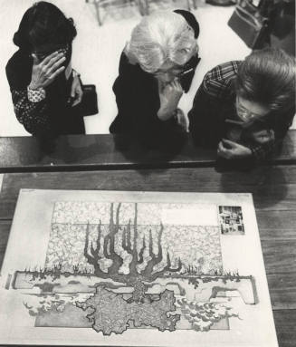 Tempe Art League Members Inspect Woodcut