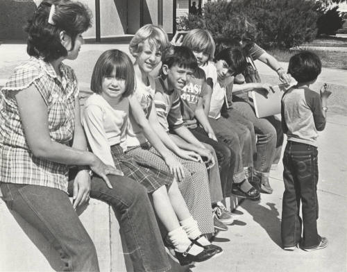 Students Wait Outside Bustoz School