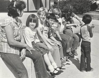 Students Wait Outside Bustoz School