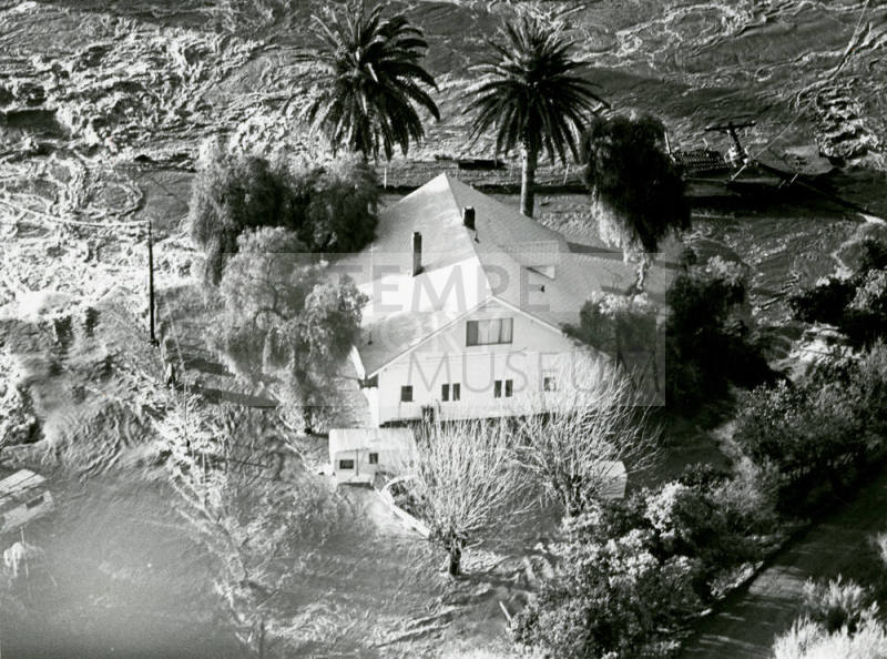 Floodwaters Surround Unidentified House