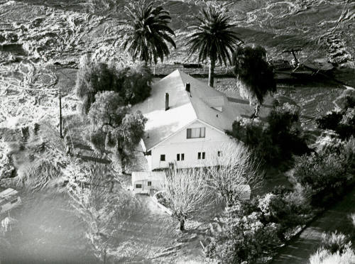 Floodwaters Surround Unidentified House