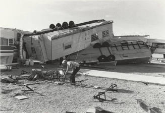 Mary Lou Knoll Surveys Trailer Damage