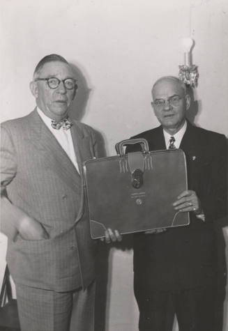 Photo- two men holding a briefcase