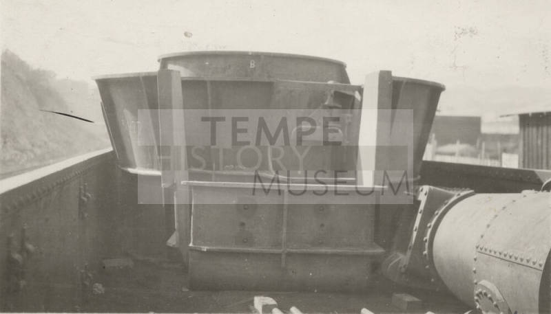 Photo- Number 7 turbine from Roosevelt Dam on train car at Miami, Arizona