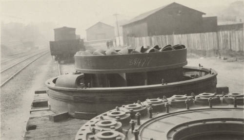 Photo- Number 7 turbine from Roosevelt Dam on train car at Miami, Arizona