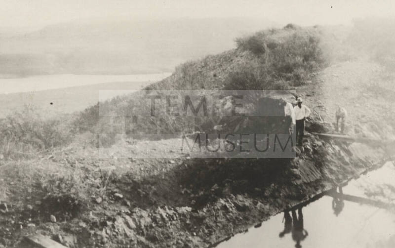 Photo- Men standing beside Roosevelt Power Canal