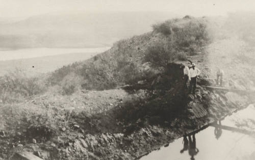 Photo- Men standing beside Roosevelt Power Canal