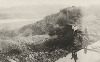 Photo- Men standing beside Roosevelt Power Canal