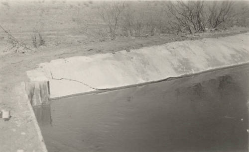 Photo- Power Canal, cement lining at 13 mile flume, cracked on river side