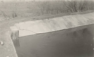 Photo- Power Canal, cement lining at 13 mile flume, cracked on river side