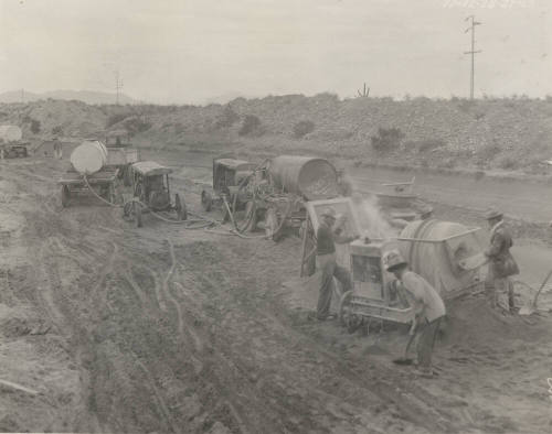 Photo-workers using portable Guniting plant to repair Great Eastern Canal lining