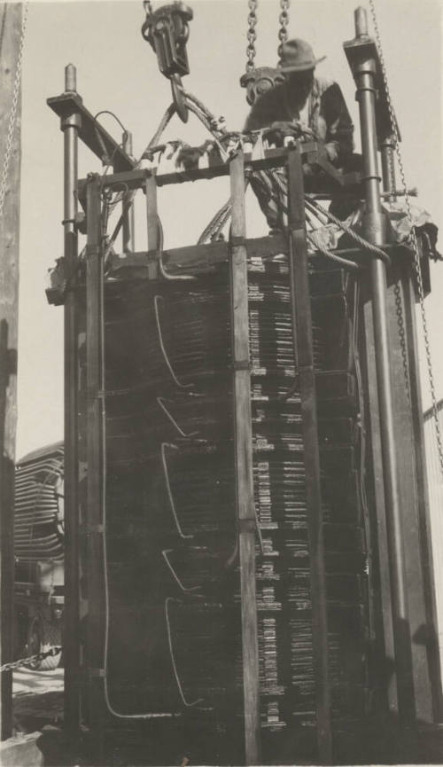 Photo- worker on a 110 KV transformer at the Mesa switching station