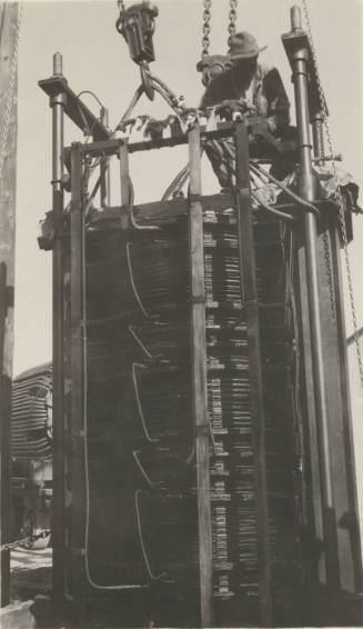 Photo- worker on a 110 KV transformer at the Mesa switching station