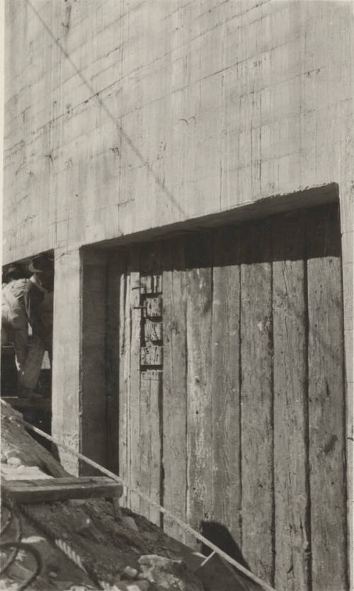 Photo- workers and section of the Mormon Flat dam