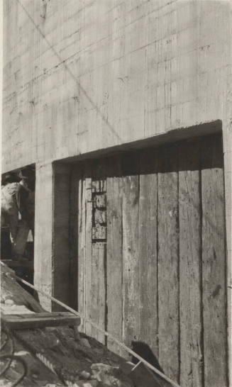 Photo- workers and section of the Mormon Flat dam