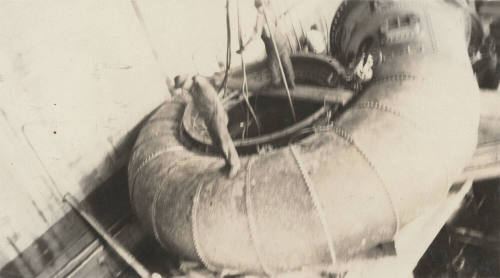 Photo- Men standing on turbine case at Horse Mesa dam