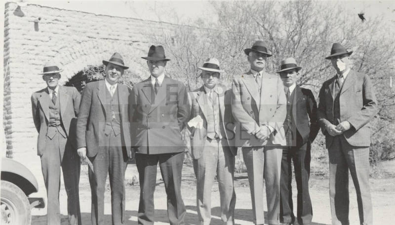 Photo- group of seven men dressed in suits and hats