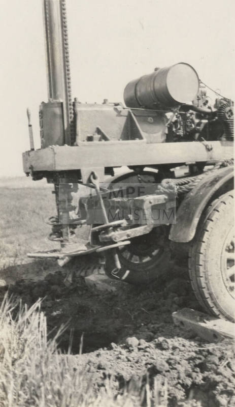 Photo- Ford truck with chain feed operating levers and feed handle