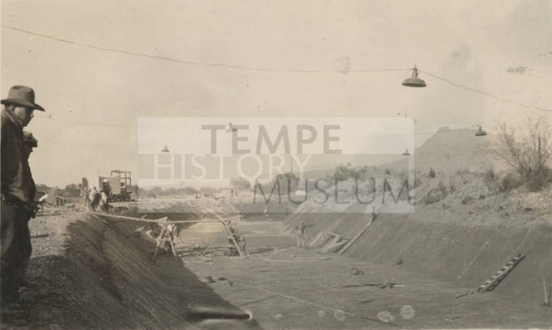 Photo- men working on canal lining