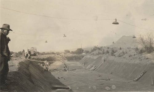 Photo- men working on canal lining